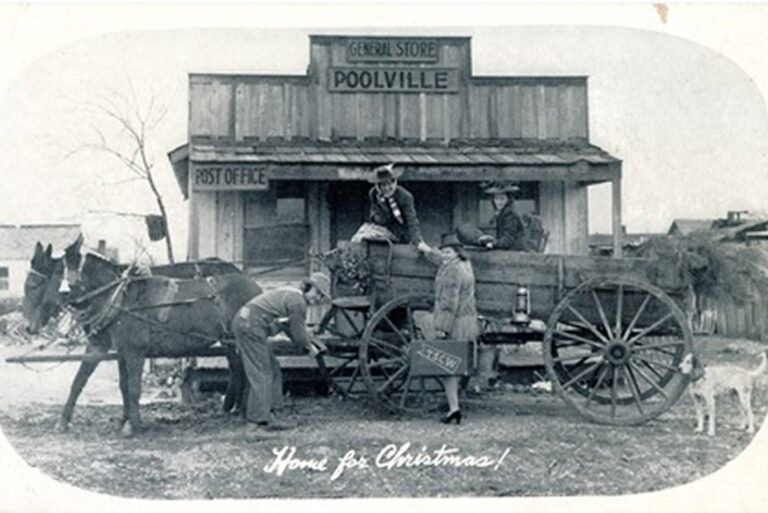 A family with a wagon and mules stops at Poolville General Store/Post Office. “Home for Christmas!” is written on the photo.