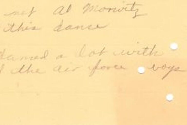 Faded handwritten text on yellowed, worn paper with three small holes on the right side.