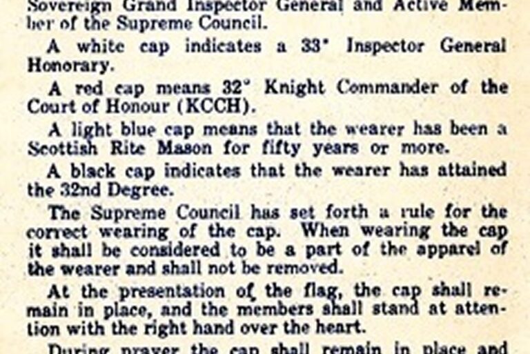 Close-up of a vintage document explaining color codes for Masonic caps and proper cap etiquette.
