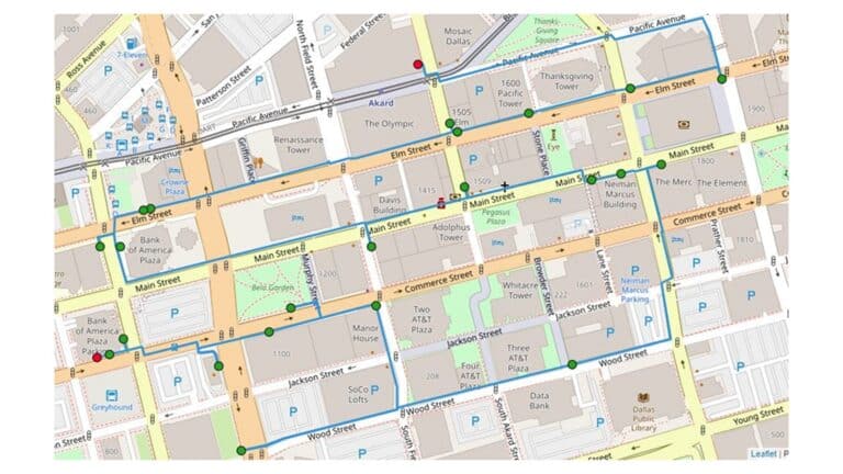 A downtown city map shows streets, buildings, parking areas, and bus stops marked by colored dots.