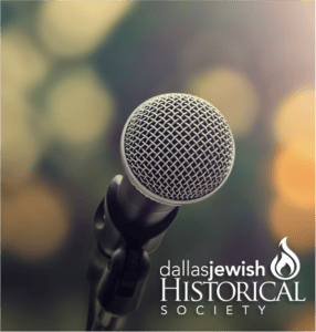 Close-up of a microphone with the Dallas Jewish Historical Society logo in the corner, blurred lights in background.