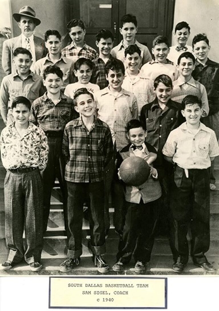 Black-and-white photo of a boys’ basketball team and coach posing on steps, holding a basketball, circa 1940.