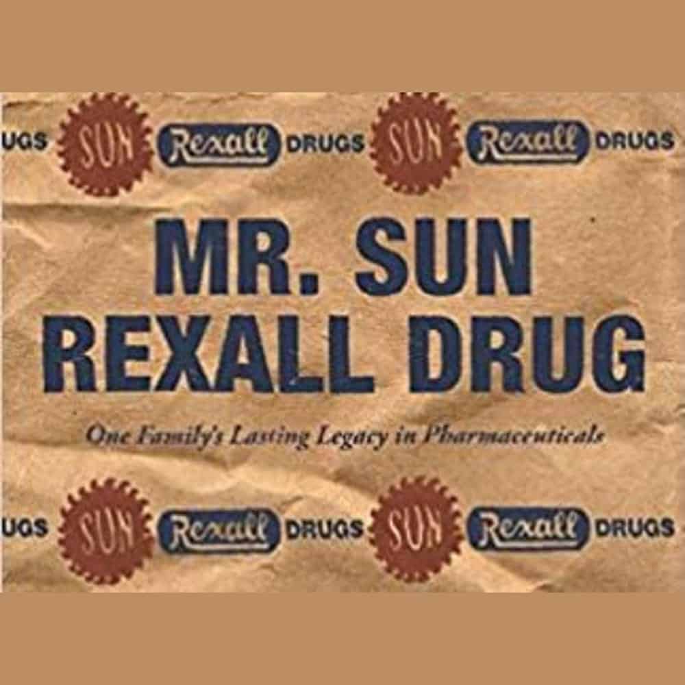 Brown paper bag reads “MR. SUN REXALL DRUG,” with logos and “One Family’s Lasting Legacy in Pharmaceuticals” underneath.